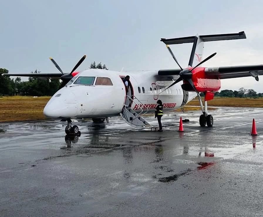 Skyward Express (Skyward Airlines) De Havilland Dash 8 turboprop on the wet apron, a regional aircraft used by the Kenyan carrier for domestic flights including routes to Mombasa, Ukunda, Malindi, and other destinations across Kenya and East Africa.