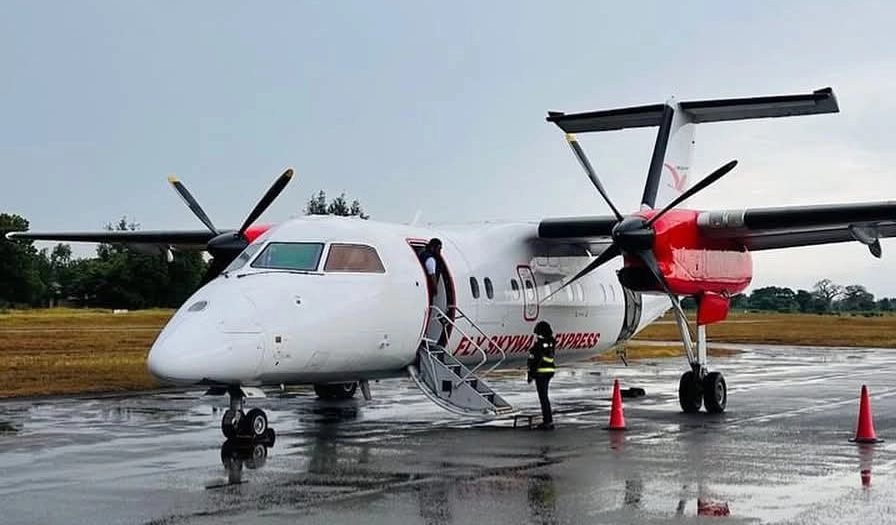 Skyward Express (Skyward Airlines) De Havilland Dash 8 turboprop on the wet apron, a regional aircraft used by the Kenyan carrier for domestic flights including routes to Mombasa, Ukunda, Malindi, and other destinations across Kenya and East Africa